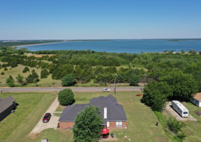 Drone photo of a house and surrounding area.